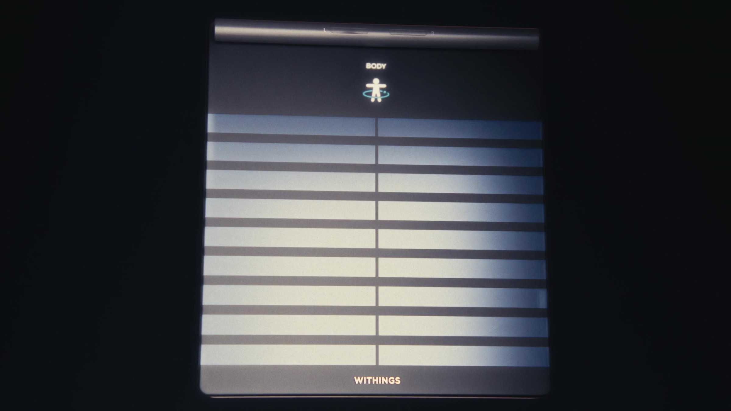 Front view of the Withings smart scale, “Body” screen lit
