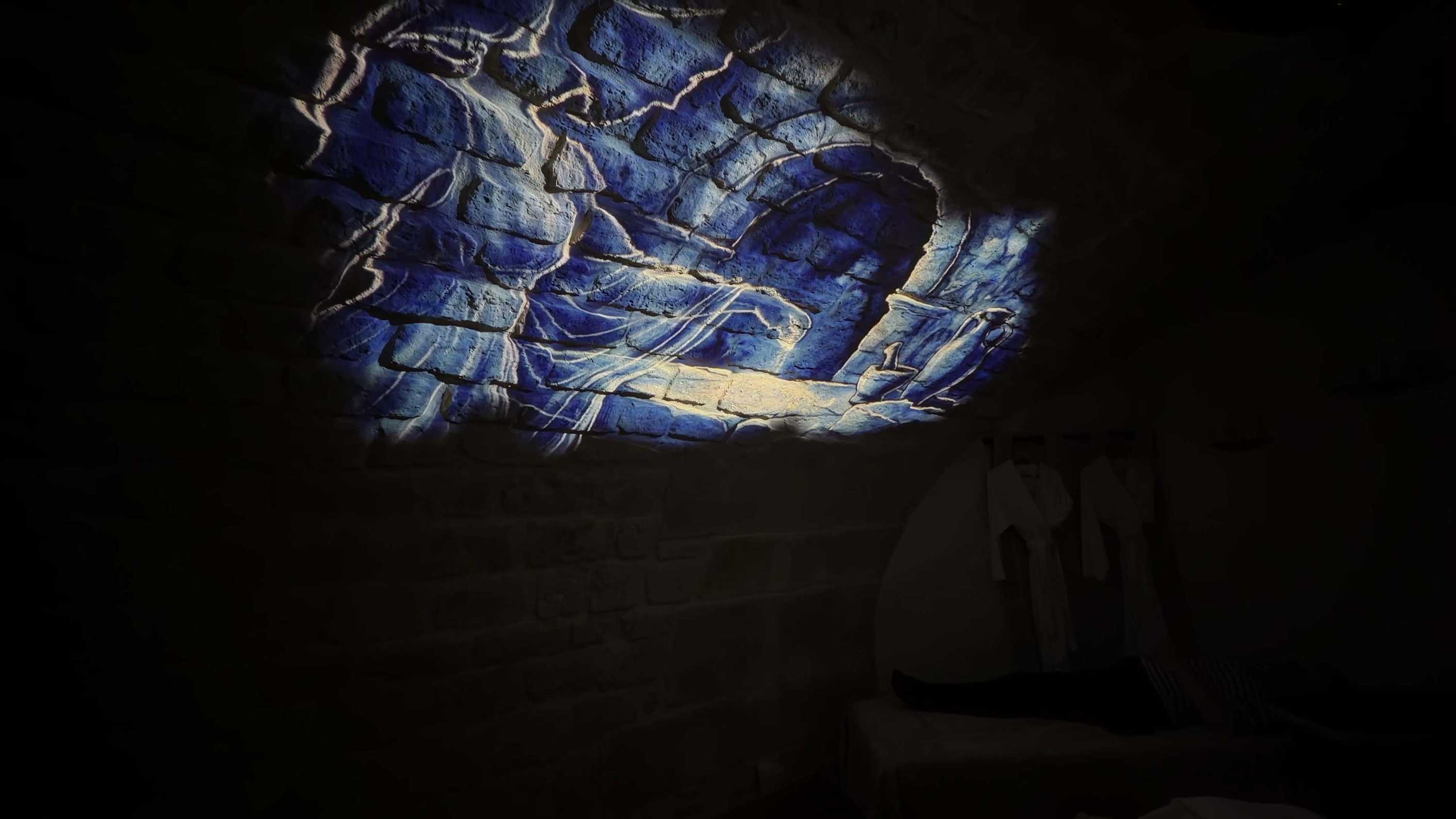 Spa Clemens: Luminous water figure projected onto historic stone vault.